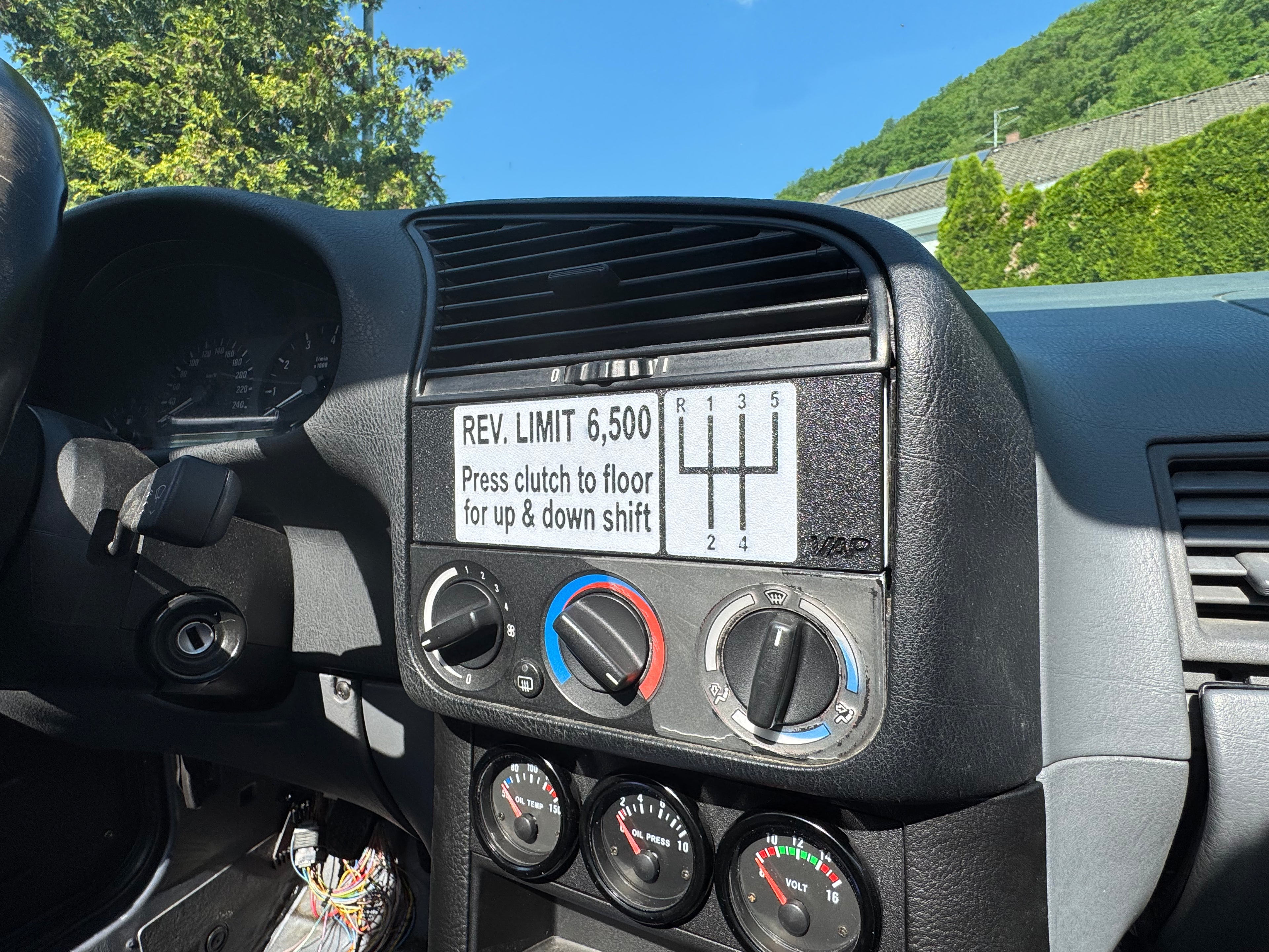 BMW E36 DIN radio plate installed in dashboard