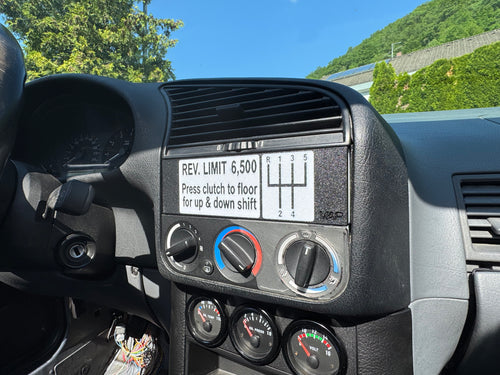 BMW E36 DIN radio plate installed in dashboard