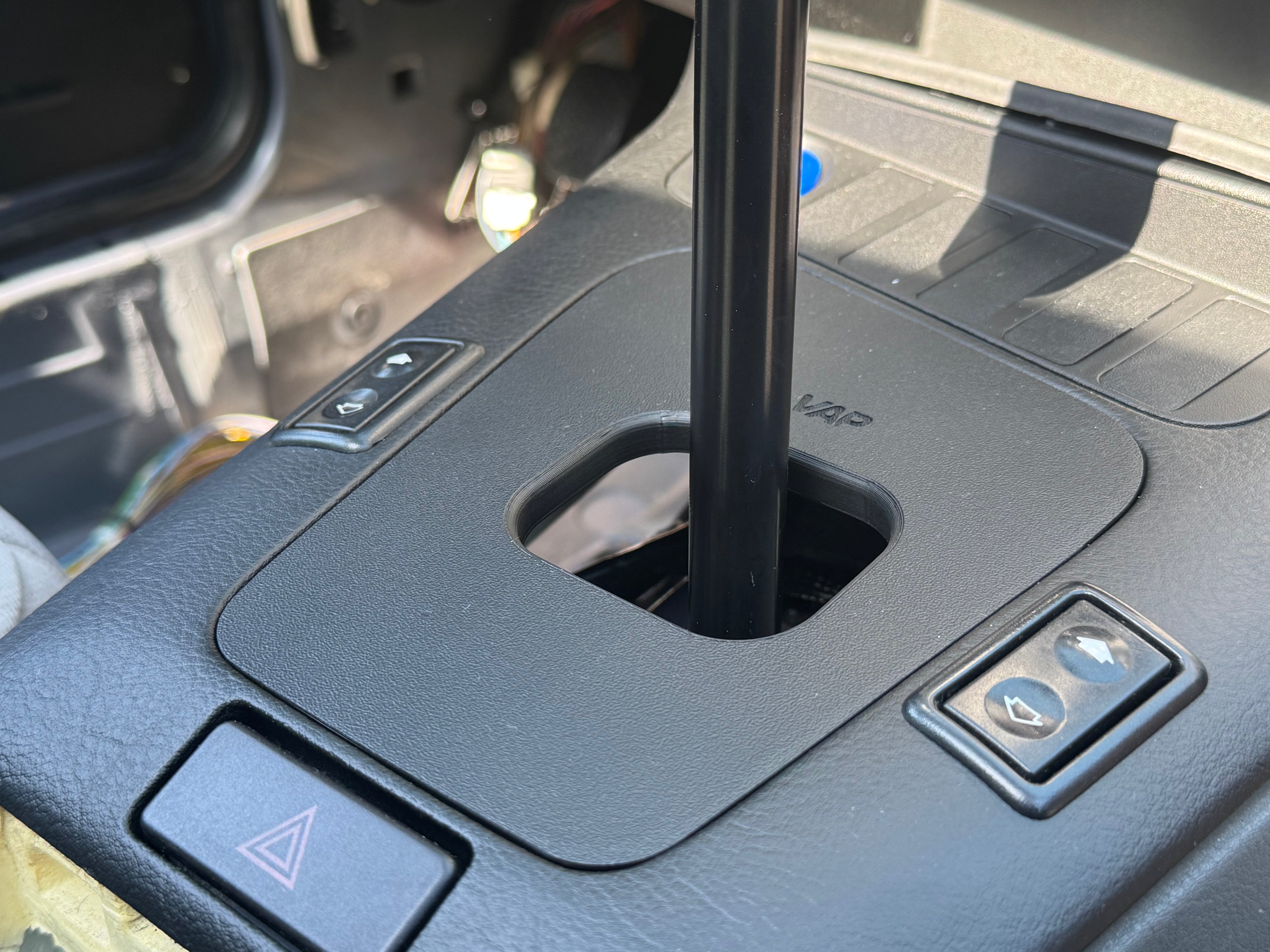 BMW E36 shift boot delete cover installed in center console